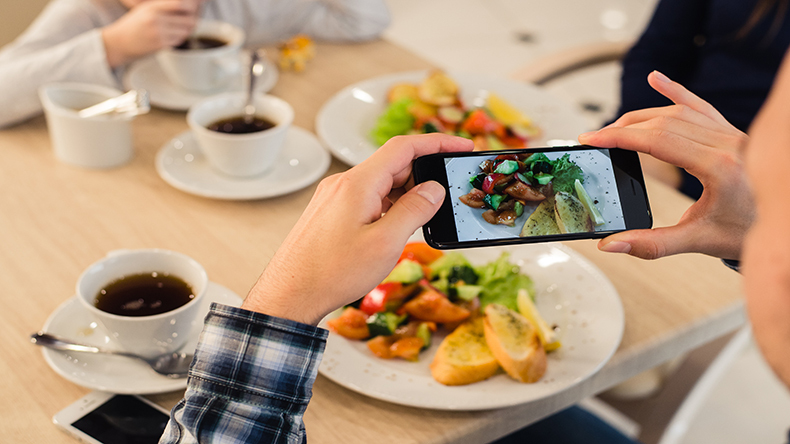 Close up mans hands taking picture of food with P57 YRF Yresized