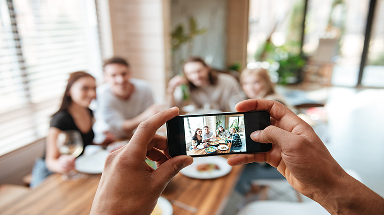 Closeup of man taking pictures of friends with P5 V4 CP Sresized